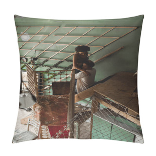 Personality  High Angle View Of Young Multiethnic Couple Embracing On Stairs In Workshop With Decorative Lattice Pillow Covers