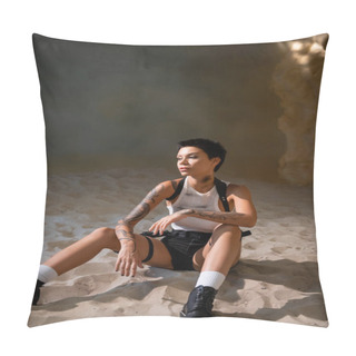 Personality  Full Length Of Tattooed And Sexy Archaeologist In Dirty Crop Top And Sexy Shorts Sitting On Sand In Cave Pillow Covers