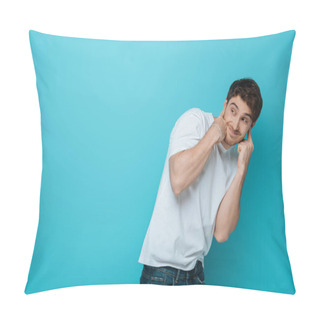 Personality  Displeased Young Man Plugging Ears With Fingers While Looking Away On Blue Background Pillow Covers