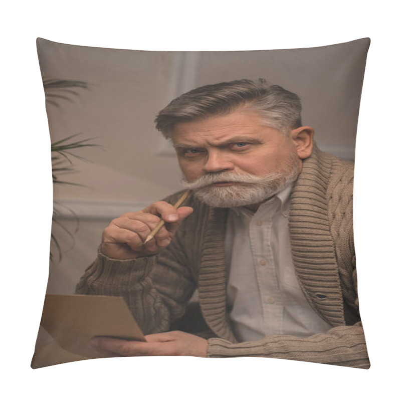 Personality  thoughtful senior man writing letter and looking at camera pillow covers