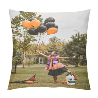 Personality  Cheerful Girl In Halloween Dress Holding Balloons Near Pumpkin, Witch Hat And Candy Bucket On Grass Pillow Covers