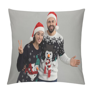 Personality  Happy Young Couple In Christmas Sweaters And Santa Hats On Grey Background Pillow Covers