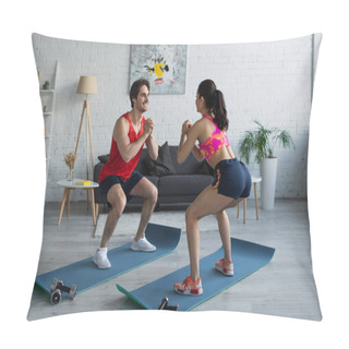 Personality  Positive Young Couple In Sportswear Doing Squats On Fitness Mats In Modern Loft Pillow Covers