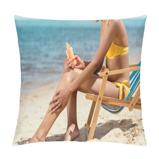 Personality  Cropped Image Of Woman Applying Sunscreen Lotion On Skin While Sitting On Deck Chair On Sandy Beach  Pillow Covers