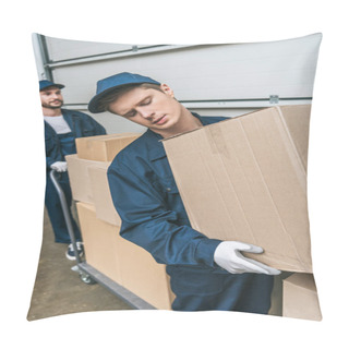 Personality  Two Handsome Movers In Uniform Transporting Cardboard Boxes With Hand Truck In Warehouse Pillow Covers