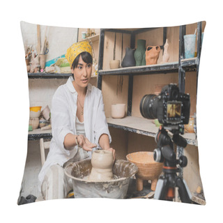 Personality  Asian Female Artisan In Workwear And Headscarf Talking And Gesturing At Digital Camera On Tripod While Working With Clay On Pottery Wheel In Art Workshop, Clay Sculpting Process Concept Pillow Covers