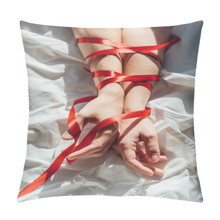 Personality  Cropped Shot Of Male And Female Hands Tied With Red Ribbon On Bed Pillow Covers