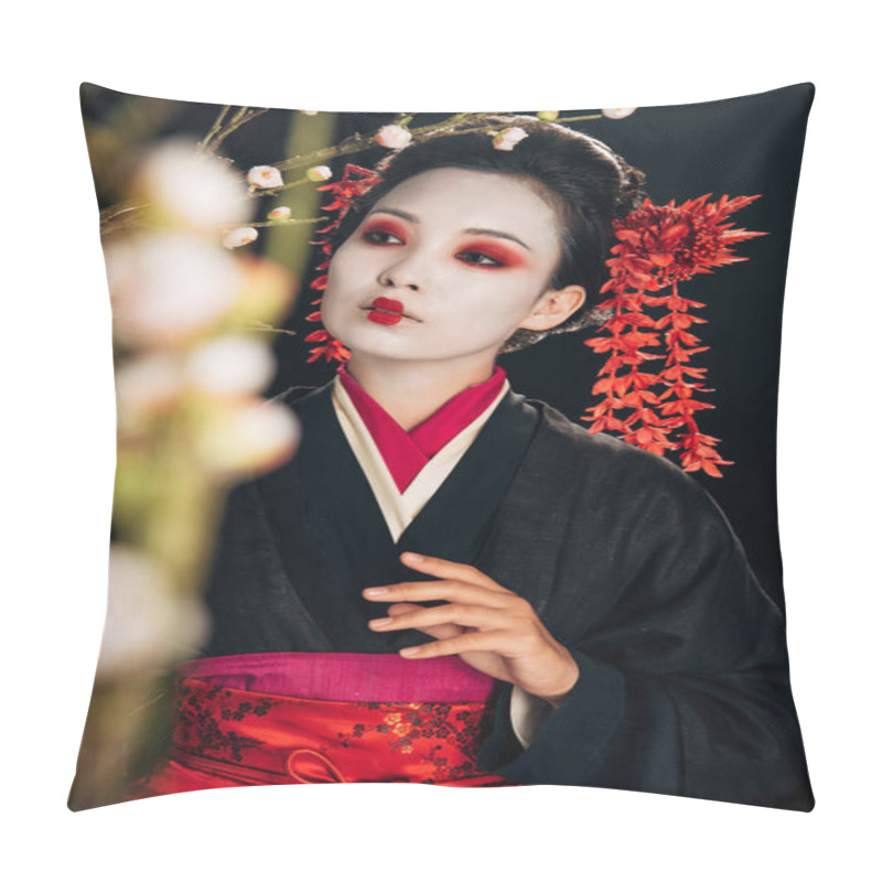 Personality  selective focus of beautiful geisha in black kimono with red flowers in hair among sakura branches isolated on black pillow covers