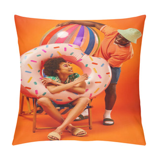 Personality  Cheerful Young African American Woman In Summer Outfit Holding Pool Ring While Sitting On Deck Chair And Looking At Best Friend With Ball On Orange Background, Fashion-forward Friends Pillow Covers