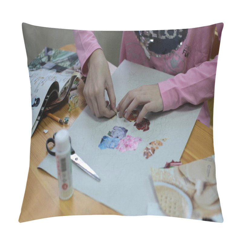 Personality  Nizhny Novgorod, Volga Region / Russia - March 04, 2020: hands of children lesson applications in the office for fine arts cutting and pasting figures, patterns or whole pictures from pieces of colorful paper pillow covers
