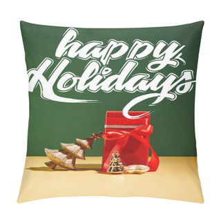 Personality  Red Gift Box And Decorative Christmas Tree With Golden Baubles On Green Background With White Happy Holidays Lettering Pillow Covers