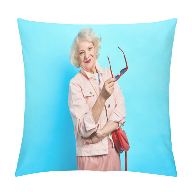 Personality  cheerful happy blonde old lady holding sunglasses and having a rest pillow covers