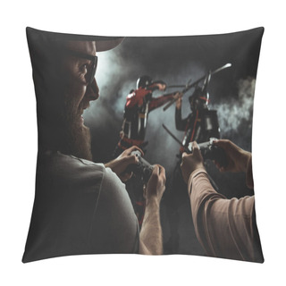 Personality  Close-up Shot Of Happy Bearded Man And Woman Playing Samurai Fighting In Real Life With Gamepads On Black Pillow Covers