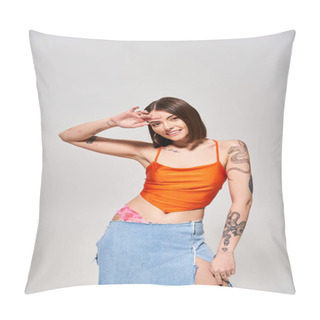 Personality  A Young Woman With Brunette Hair Confidently Poses In A Studio Wearing An Orange Top And A Flowing Blue Skirt. Pillow Covers