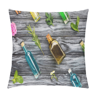 Personality  Set Of Colored Bottles With Natural Herbal Essential Oils On Wooden Surface Pillow Covers