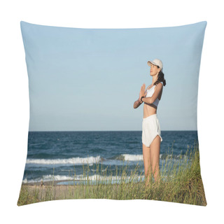 Personality  Young Fit Woman In Shorts And Sports Bra Meditating Near Blue Sea On Beach Pillow Covers