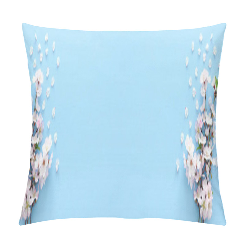 Personality  photo of spring white cherry blossom tree on pastel blue wooden background. View from above, flat lay pillow covers