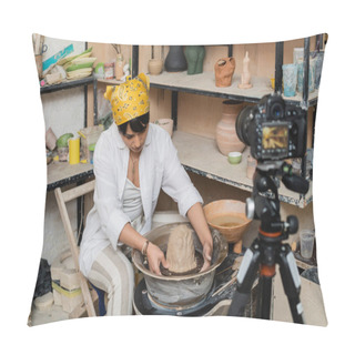 Personality  Young Asian Female Artisan In Workwear And Headscarf Molding Clay On Pottery Wheel Near Blurred Digital Camera On Tripod In Ceramic Workshop, Pottery Artist Showcasing Craft Pillow Covers