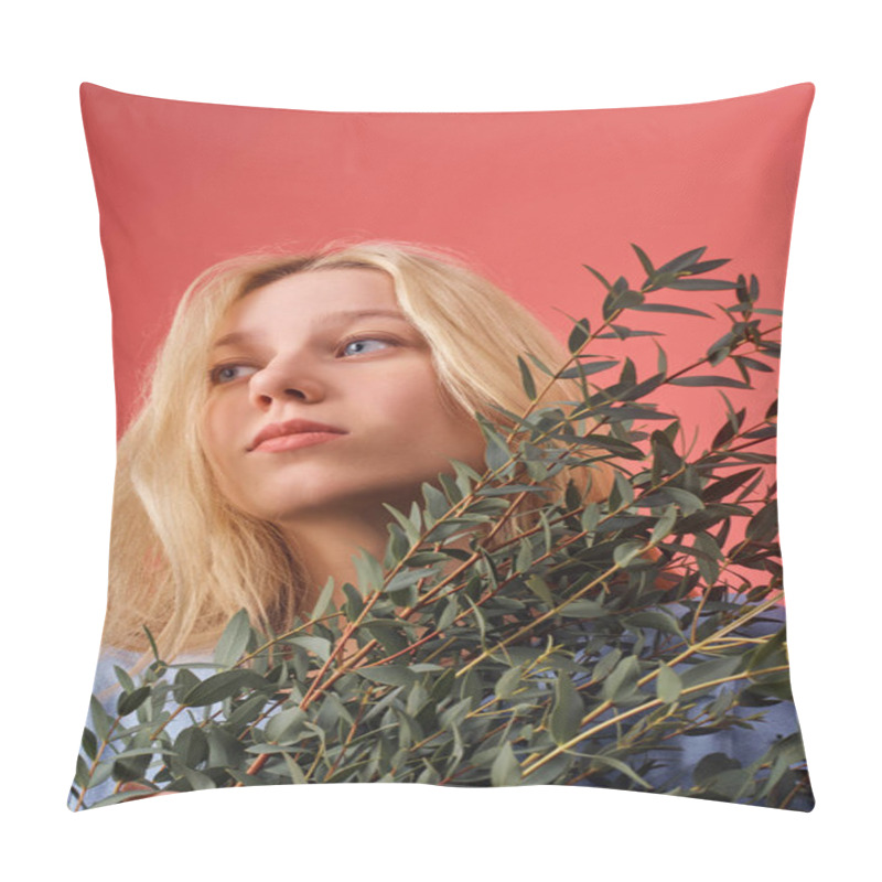 Personality  beautiful young woman with bunch of eucalyptus branches isolated on red pillow covers
