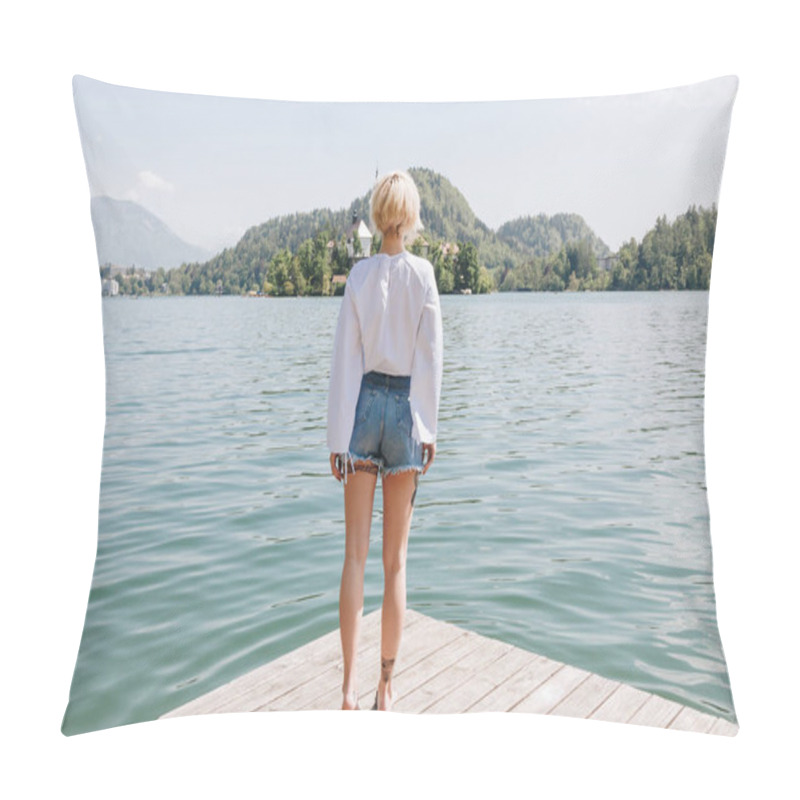 Personality  Back View Of Young Woman Standing On Wooden Pier And Looking At Scenic Mountain Lake, Bled, Slovenia Pillow Covers