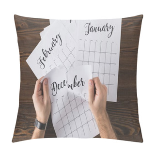 Personality  Cropped Shot Of Man Tearing Calendar On Wooden Tabletop Pillow Covers