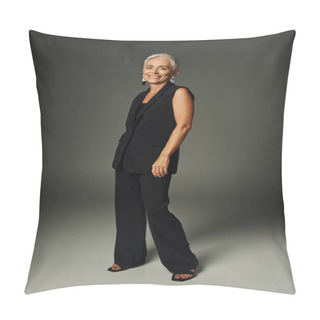 Personality  Full Length Of Smiling Senior Model In Black Classic Clothes Looking At Camera And Standing On Grey Pillow Covers