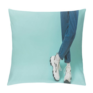 Personality  Feet Of A Child In White Sneakers With Laces And Wide Jeans On A Blue Background. Place For Text. Pillow Covers