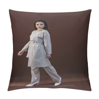 Personality  Trendy Model In Stylish Wear And White Shoes Walking On Brown Background Pillow Covers