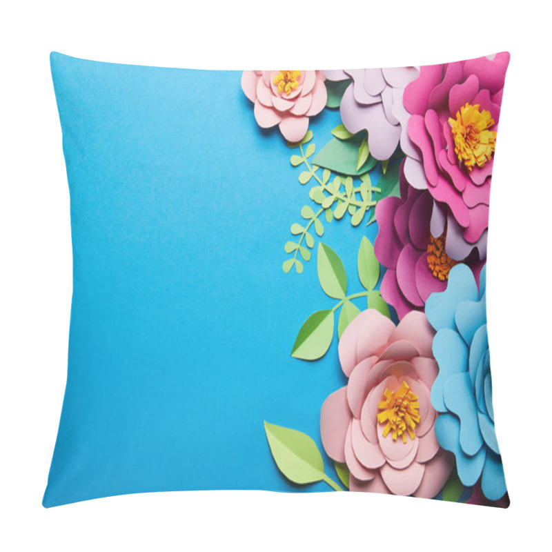 Personality  top view of colorful paper cut flowers with green leaves on blue background with copy space pillow covers