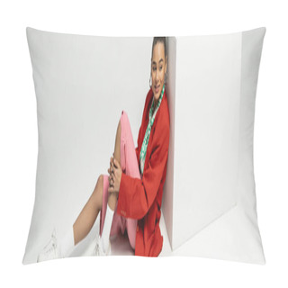 Personality  Positive African American Woman In Vibrant Clothes Sitting Near Cube On Grey Backdrop, Banner Pillow Covers