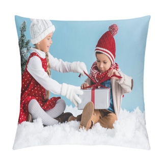 Personality  Children In Hats And Winter Outfit Sitting On Snow And Touching Present Isolated On Blue Pillow Covers