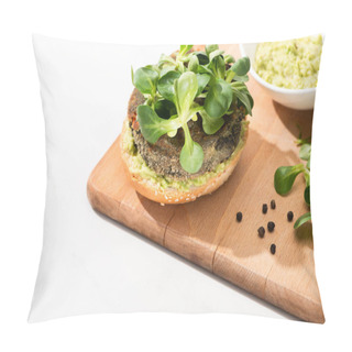 Personality  Selective Focus Of Delicious Green Vegan Burger With Microgreens And Mashed Avocado On Wooden Boar With Black Pepper On White Background Pillow Covers