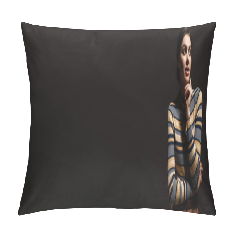 Personality  dreamy young woman in striped turtleneck looking away isolated on black, banner pillow covers