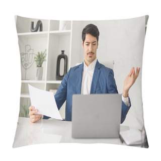 Personality  Hispanic Businessman In A Blue Suit Expressing Confusion Or Concern While Holding A Document, Seated At His Office Desk With A Laptop, Depicting A Moment Of Business Challenge Or Problem-solving Pillow Covers