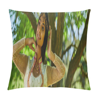 Personality  Cheerful Indian Woman In Vibrant Authentic Attire Posing And Looking Away In Park, Banner Pillow Covers