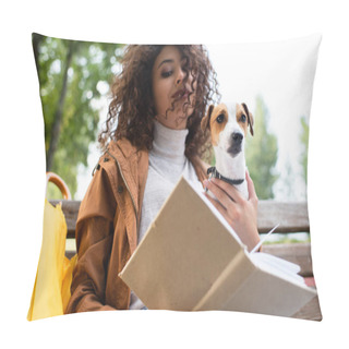 Personality  Low Angle View Of Curly Woman Holding Jack Russell Terrier Dog While Reading Book In Park Pillow Covers