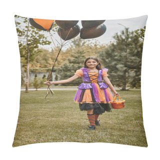 Personality  Cheerful Girl In Halloween Costume Holding Balloons And Candy Bucket While Walking On Green Grass Pillow Covers
