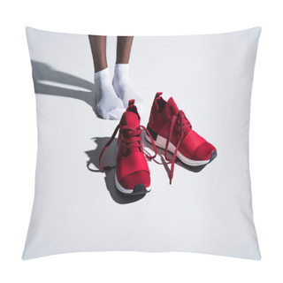 Personality  Close-up Partial View Of Sportsman In Socks And Red Sports Shoes On Grey Pillow Covers