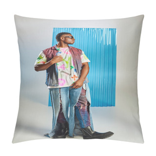 Personality  Side View Of Stylish Afroamerican Man In Sunglasses, Colorful Denim Vest And Ripped Jeans Posing On Grey With Blue Polycarbonate Sheet At Background, Sustainable Fashion, DIY Clothing Pillow Covers