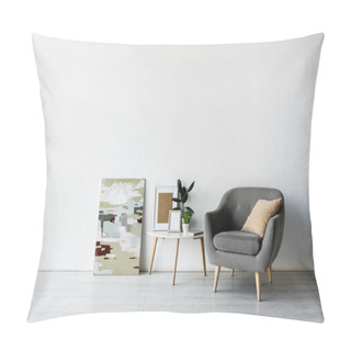 Personality  Pillow On Grey Armchair Near Coffee Table With Green Plants And Frames In Modern Living Room  Pillow Covers