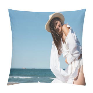 Personality  Joyful Young Woman In White Shirt Holding Sun Hat Near Sea On Beach  Pillow Covers