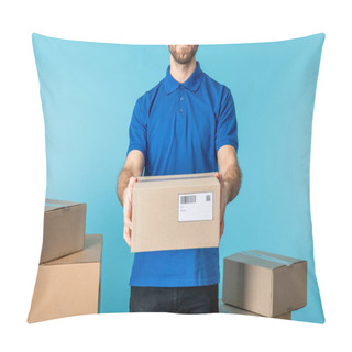Personality  Cropped View Of Courier Holding Cardboard Package Near Boxes Isolated On Blue Pillow Covers
