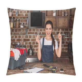 Personality  Happy Young Repairwoman With Light Bulb Pointing Up And Looking At Camera Pillow Covers