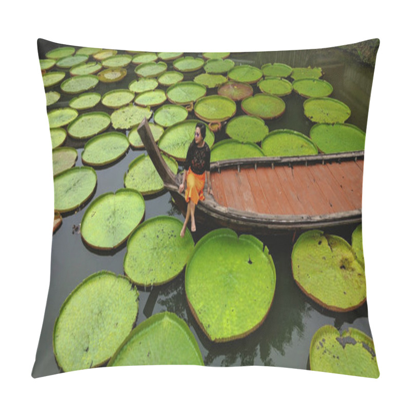 Personality  Drone shot of Girl on Boat surrounded by Victoria Amazonica Natural landscape aquatic plants pillow covers