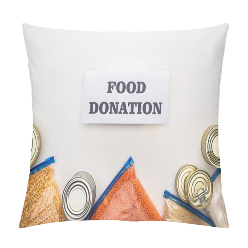 Personality  Top View Of Cans And Groats In Zipper Bags Near Card With Food Donation Lettering On White Background Pillow Covers