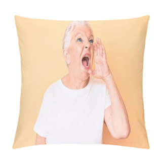 Personality  Senior Beautiful Woman With Blue Eyes And Grey Hair Wearing Classic White Tshirt Over Yellow Background Shouting And Screaming Loud To Side With Hand On Mouth. Communication Concept.  Pillow Covers