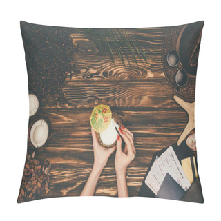 Personality  Cropped Shot Of Woman With Coconut Cocktail Surrounded With Various Tropical Travel Attributes On Wooden Surface Pillow Covers