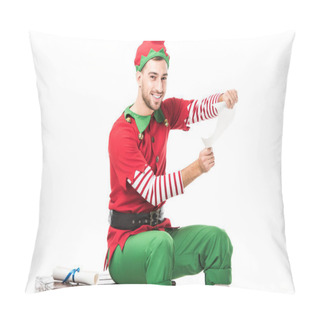 Personality  Smiling Man In Christmas Elf Costume Sitting And Holding Wishlist Roll Isolated On White Pillow Covers