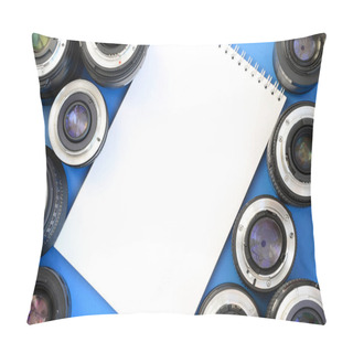 Personality  Several Photographic Lenses And White Notebook Lie On A Bright Blue Background. Space For Text Pillow Covers