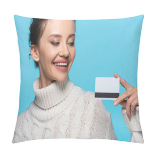 Personality  Smiling Woman In Knitted Sweater Looking At Credit Card Isolated On Blue Pillow Covers